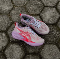 Asics Novablast 5 Running Trainers in pink and red