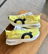 ON RUNNING CLOUDBOOM STRIKE LIMELIGHT YELLOW