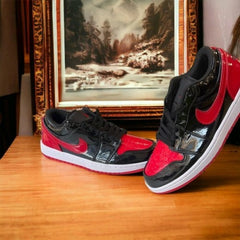 JORDAN RETRO 1 LOW PATENT BRED