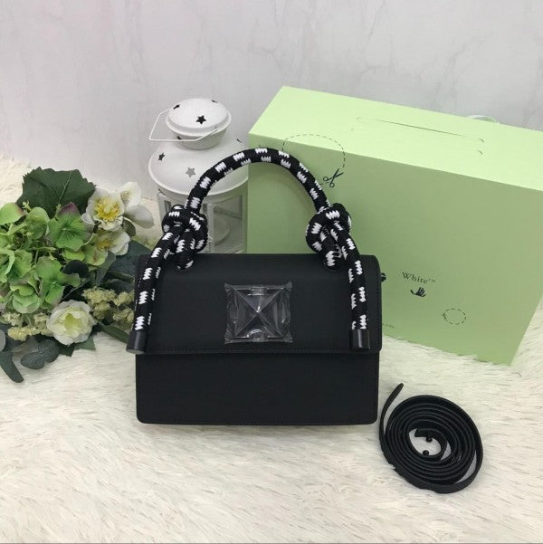 Off-White Leather Insert Black Gummy with Metallic Black Arrows At Front. Rope Handle Jitney 1.4 Shoulder Bag (D88532 Black)