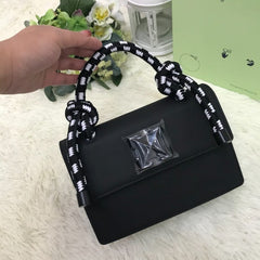 Off-White Leather Insert Black Gummy with Metallic Black Arrows At Front. Rope Handle Jitney 1.4 Shoulder Bag (D88532 Black)