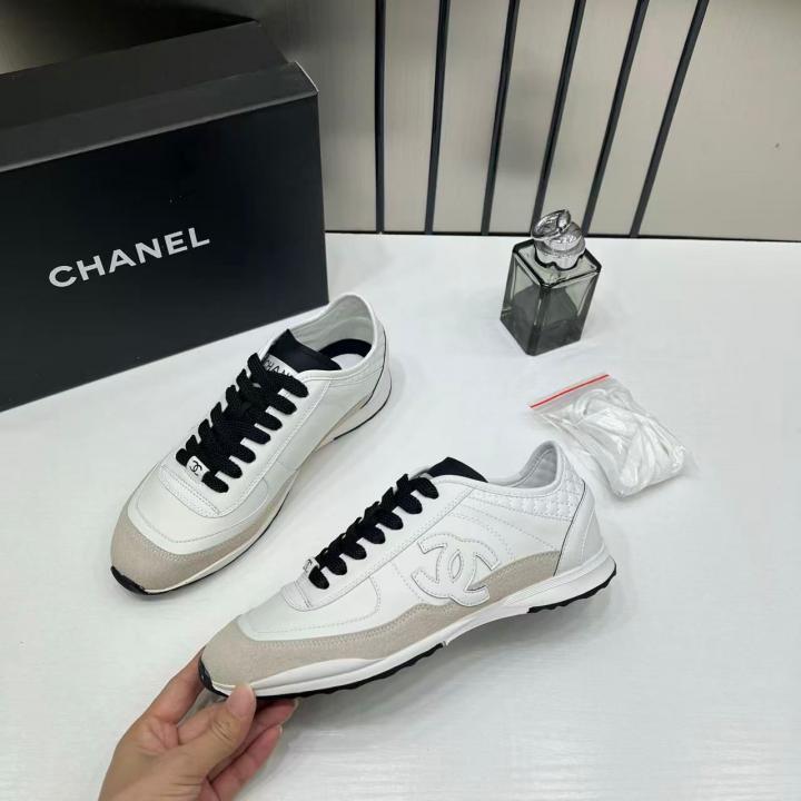 Chanel white calfskin and suede CC sneakers.