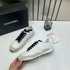 Chanel white calfskin and suede CC sneakers.
