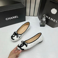 Chanel Quilted Cambon Leather Ballet Flats In White & Black With black Toe Bow With OG Box & Carry Bag