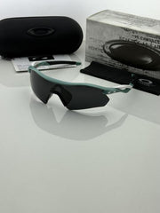 Oakley 9495 blue black prizm polarized lens