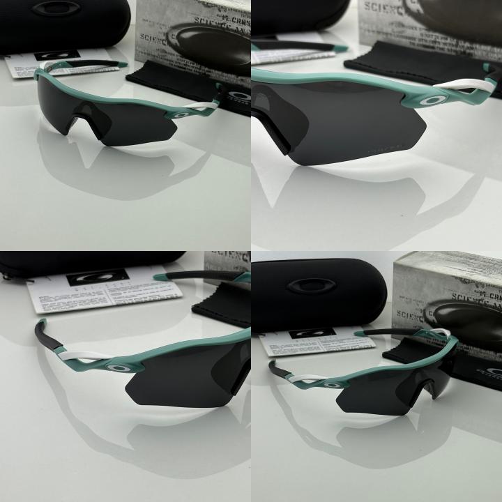 Oakley 9495 blue black prizm polarized lens